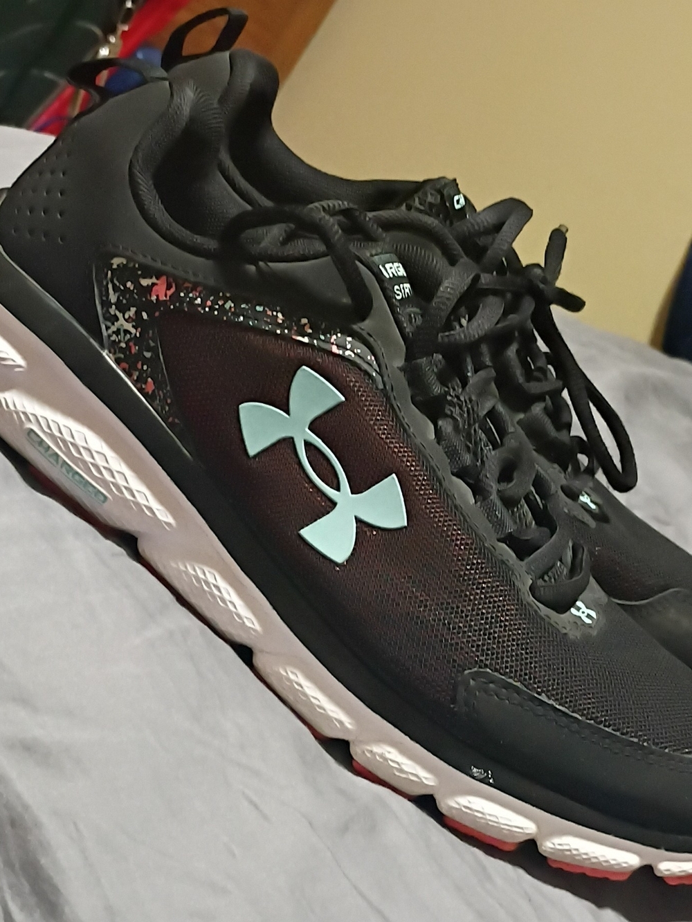 Under Armour Women’s Black Running Shoes with Teal Logo